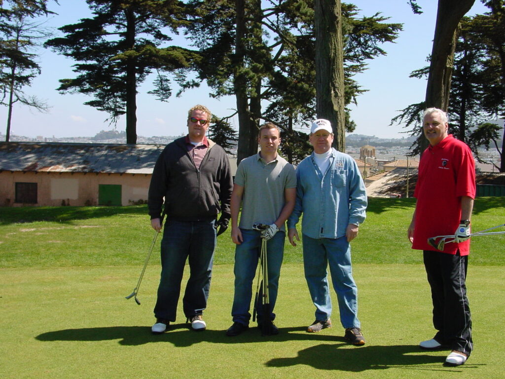 Mark with friends on the golf course CMG